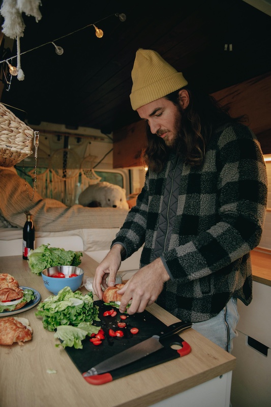 Preparing food in a camper van